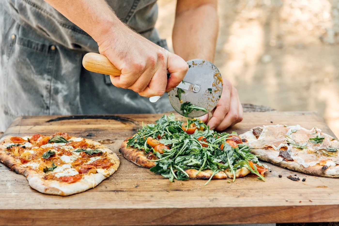 Hosting a Pizza Party Will Be The Most Fun You Have All Summer—Here’s Exactly How to Do It