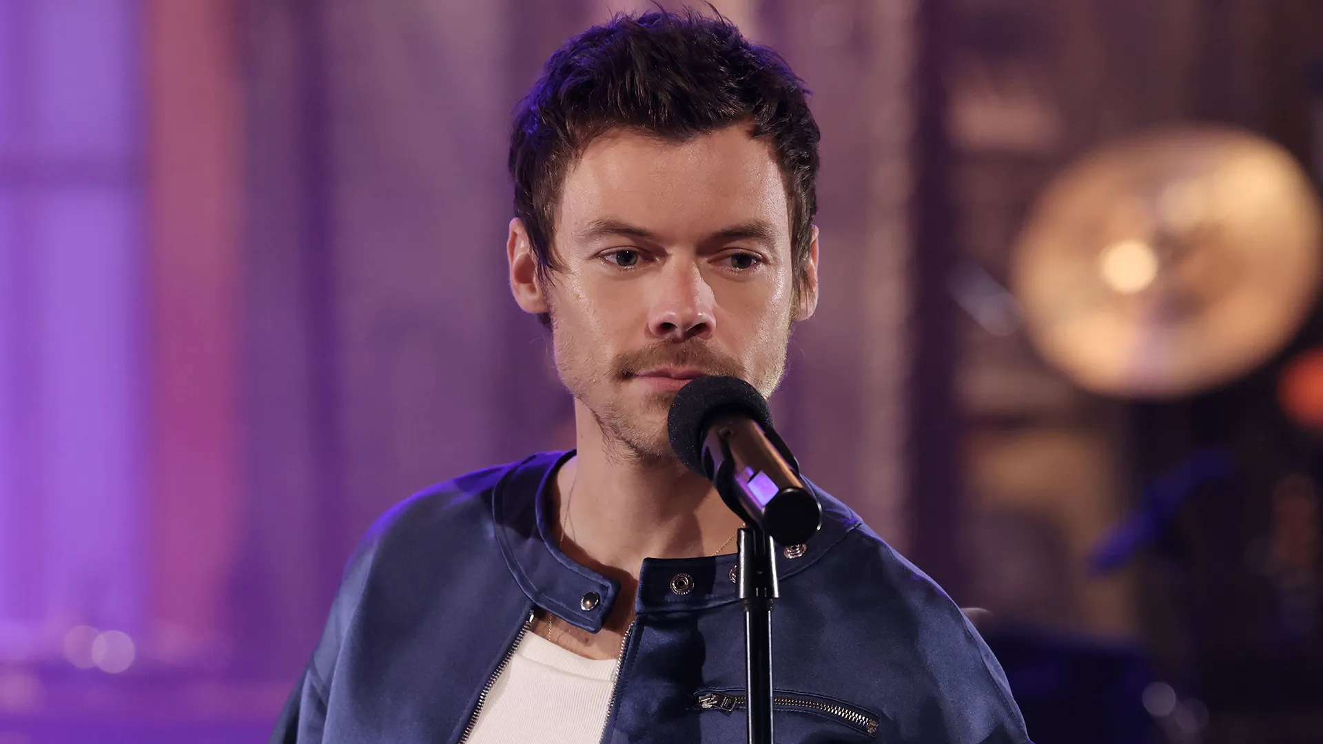 ‘SNL’ Promos: Harry Styles Catches Marcello Hernández In The Act