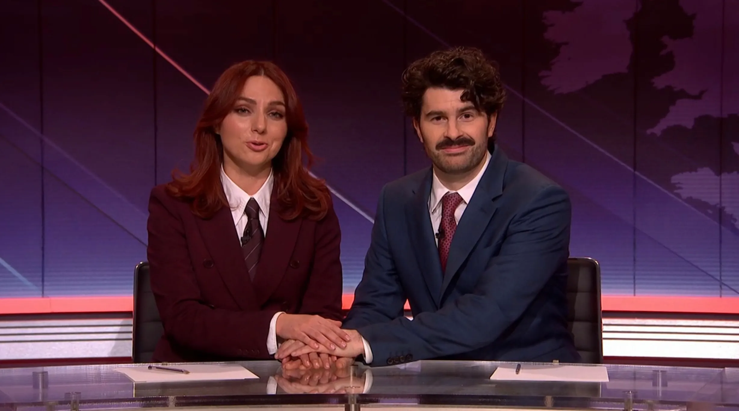 ‘SNL U.K.’ Weekend Update Pokes Fun at Trump and Iran’s Mixed Messages About Deal Negotiations: ‘Oh My God, Just Kiss Already!’